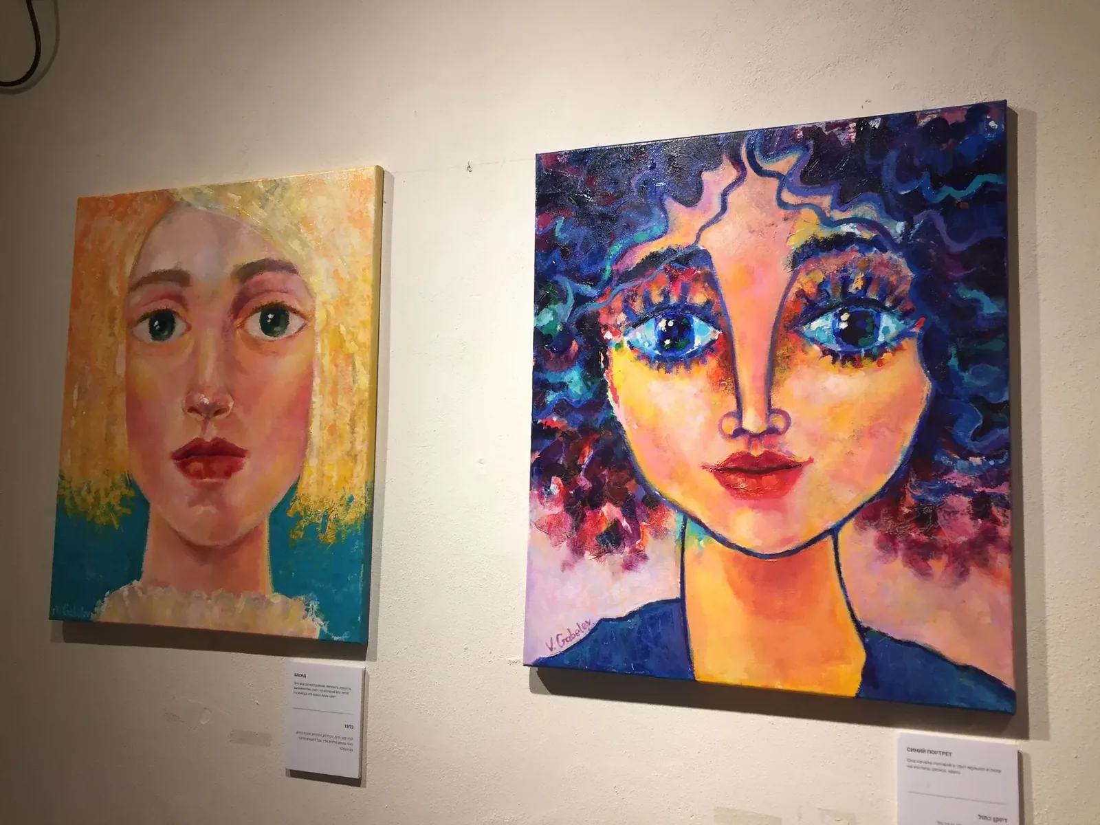 Colorful portrait paintings at an exhibition